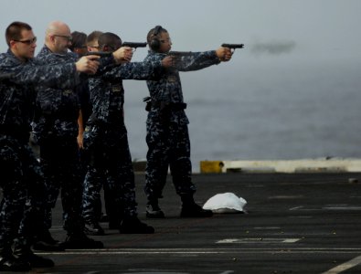 US Navy 100716-N-6362C-072 Security department Sailors participate in small-arms qualification aboard the aircraft carrier USS Harry S. Truman (CVN 75)