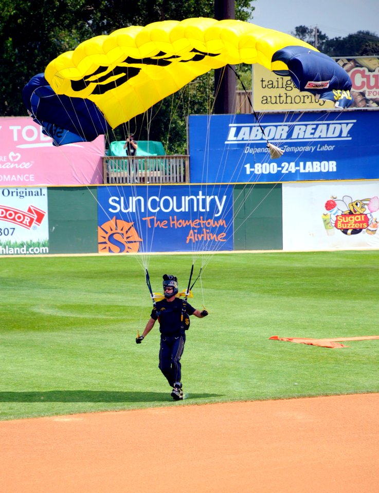 US Navy 100720-N-5366K-096 James Woods touches down after parachuting into the opening ceremony of a St. Paul Saints baseball game at Midway Stadium