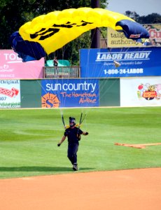 US Navy 100720-N-5366K-096 James Woods touches down after parachuting into the opening ceremony of a St. Paul Saints baseball game at Midway Stadium