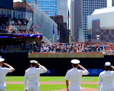 US Navy 100721-N-0869H-089 Sailors salute the national ensign during the National Anthem at Target Field before a Minnesota Twins game