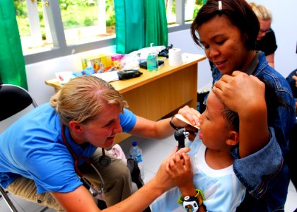 US Navy 100720-N-4044H-292 Latter-day Saint Charities Nurse Practitioner Michelle Crawford performs a general examination during a Pacific Partnership 2010 medical civic action program