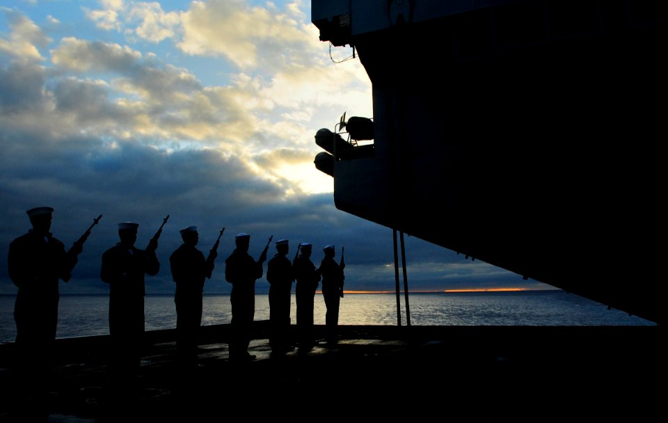 US Navy 100721-N-3595W-007 Sailors present arms during a sunrise burial at sea aboard USS Dwight D. Eisenhower (CVN 69)