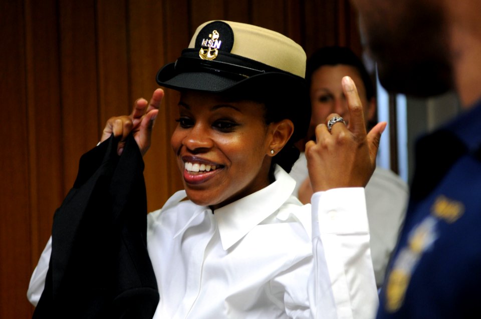 US Navy 100719-N-4930E-366 Navy Reserve Sailor of the Year Hospital Corpsman 1st Class Shalanda Brewer smiles as she finds the right fit for her Chief Petty Officer cover at the Navy Annex