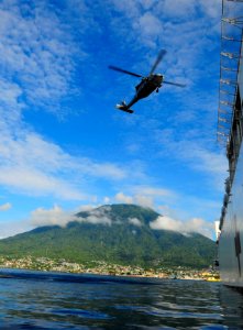 US Navy 100720-N-6410J-015 An MH-60S Sea Hawk helicopter assigned to the Wild Cards of Helicopter Sea Combat Squadron (HSC) 23, prepares to land aboard the Military Sealift Command hospital ship USNS Mercy (T-AH 19) photo