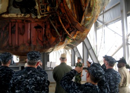 US Navy 100722-N-0000X-001 Sailors assigned to the aircraft carrier USS George Washington (CVN 73) and Carrier Task Force (CTF) 70 look at damage to the Republic of Korea corvette (ROKS) Cheonan (PCC-772)
