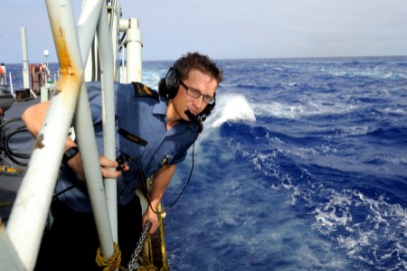 US Navy 100719-O-0000S-100 Leading Seaman Michael Critch stands watch during a replenishment at sea