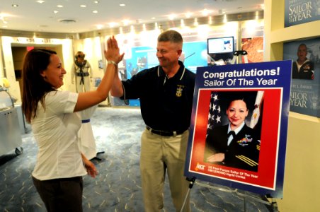 US Navy 100719-N-9818V-572 Hospital Corpsman 1st Class Ingrid Cortez, U.S. Fleet Forces Sea Sailor of the Year, gets at high five from Master Chief Petty Officer of the Navy (MCPON) Rick West