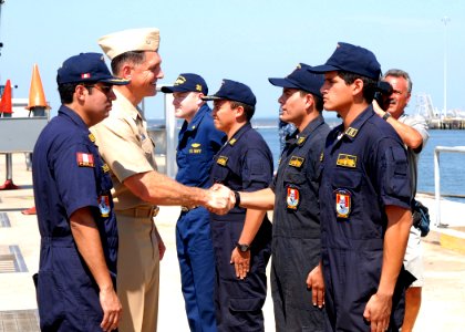 US Navy 100722-N-7705S-052 Capt. Frank Cattani, commander of Submarine Squadron (SUBRON) 8 greets the crew of the Peruvian navy submarine BAP Angamos (SS-31) after arriving at Naval Station Norfolk