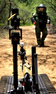 US Navy 100719-O-5986R-052 An Australian sailor assigned to Australian Clearance Diving Team 1 operates a Talon bomb disposal robot at an explosive ordnance disposal training site during Rim of the Pacific (RIMPAC) 2010