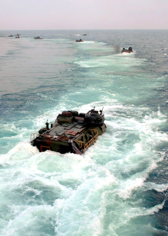 US Navy 100723-N-8069G-079 Amphibious assault vehicles leave the well deck of USS Carter Hall (LSD 50)