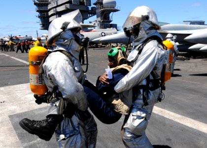 US Navy 100720-N-6935K-002 Sailors carry a simulated casualty victim during a fire and mass casualty drill aboard the Nimtiz-class aircraft carrier USS Dwight D. Eisenhower (CVN 69)