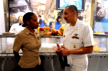 US Navy 100720-N-9818V-260 Navy Reserve Sailor of the Year, Hospital Corpsman 1st Class Shalanda Brewer, speaks with Force Master Chief Ronney Wright, U.S. Navy Reserve Force, at the Navy Memorial before attending Concert on th