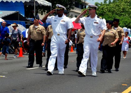US Navy 100721-N-1722W-231 Sailors assigned to the submarine tender USS Frank Cable (AS 40) render honors to the commanders of Guam's military forces during Guam's 66th annual Liberation Day celebration parade