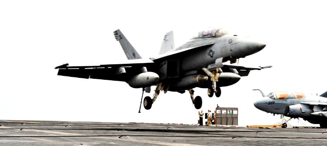US Navy 100724-N-6003P-085 An F-A-18F Super Hornet approaches USS Harry S. Truman (CVN 75)