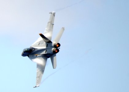 US Navy 100724-N-4236E-584 An F-A-18F Super Hornet assigned to the Jolly Rogers of Strike Fighter Squadron (VFA) 103 flies by the aircraft carrier USS Dwight D. Eisenhower (CVN 69)
