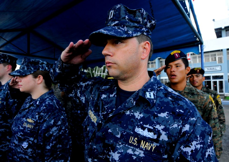 US Navy 100722-N-9643W-086 Lt. Sean Evenson salutes during the national anthem at the Southern Partnership Station (SPS) 2010 closing ceremony in Guatemala