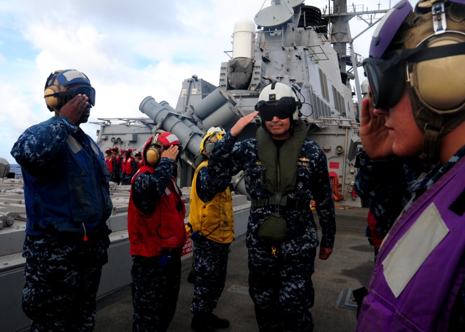 US Navy 100721-N-3570S-364 Vice Adm. Richard W. Hunt, commander of Rim of the Pacific (RIMPAC) 2010 Combined Task Force, salutes rainbow sideboys as he departs the Arleigh Burke-class guided-missile destroyer USS Benfold (DDG 6