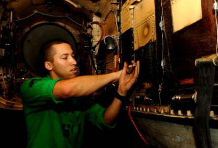 US Navy 100723-N-1092P-072 Cpl. Chris Stanislawski prepares to conduct a fire bottle extinguisher test on an F-A-18C Hornet