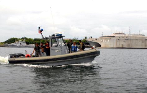 US Navy 100721-N-4971L-119 Sailors conduct small boat operations with Guatemala defense forces during a subject matter expert exchange in Puerto Quetzal, Guatemala photo