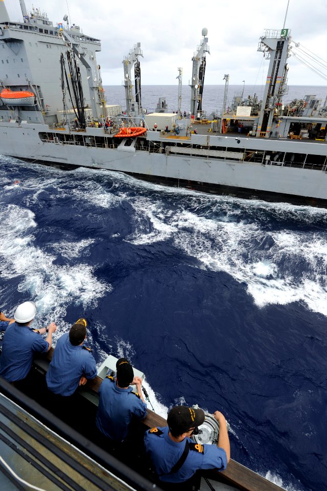 US Navy 100721-O-2028S-005 Members of the bridge team, including Cmdr. Angus Topshee, commanding officer of the Canadian navy destroyer HMCS Algonquin, R17), observe a replenishment at sea