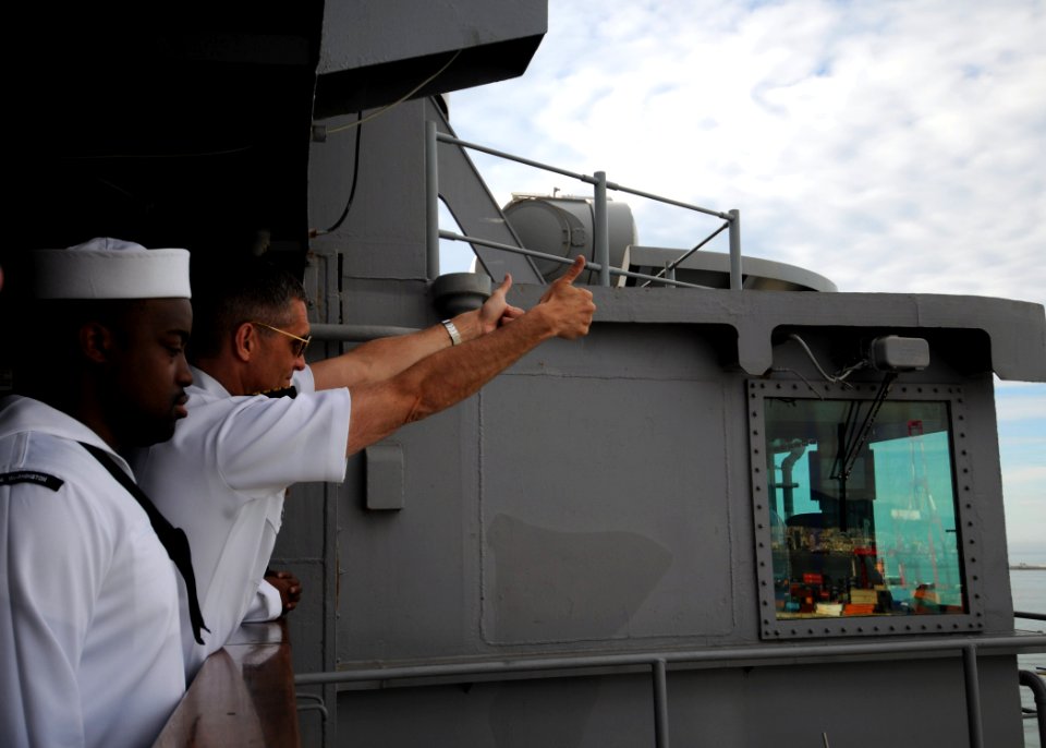 US Navy 100725-N-4830B-009 Sailors watch from aboard the ship as the aircraft carrier USS George Washington (CVN 73) departs Busan, Republic of Korea