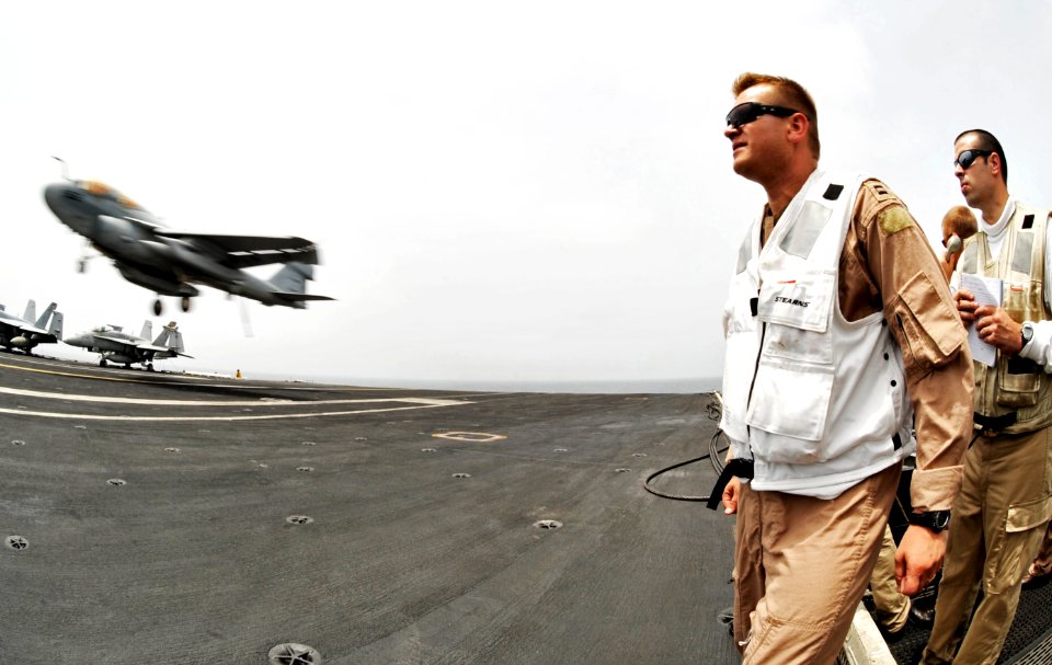 US Navy 100725-N-6003P-230 anding signal officers watch an EA-6B Prowler assigned to the Zappers of Electronic Attack Squadron (VAQ) 130