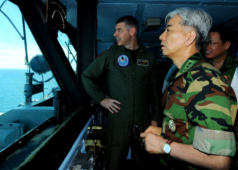US Navy 100726-N-4830B-062 Gen. Min Goo Han discusses ship formations with Capt. Daniel Grieco
