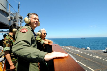 US Navy 100726-N-4830B-042 Capt. Daniel Grieco, center, and Gen. Min Goo Han watch flight operations from the signal bridge aboard USS George Washington (CVN 73)