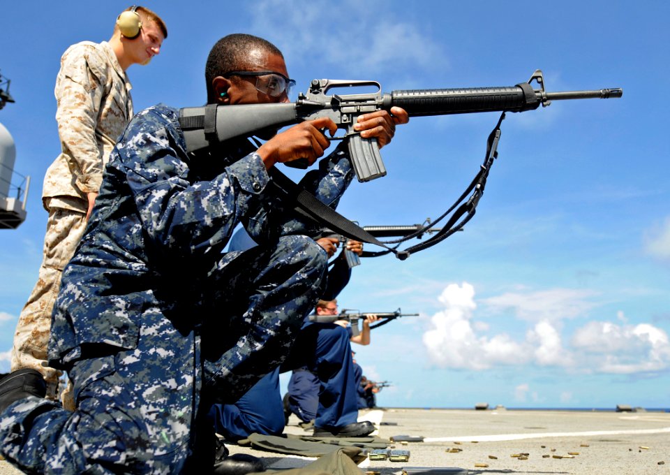 US Navy 100723-N-7280V-347 Operations Specialist 2nd Class Marcus Broomfield fires an M-16 rifle during a weapons qualification shoot aboard the U.S. 7th Fleet command ship USS Blue Ridge (LCC 19)