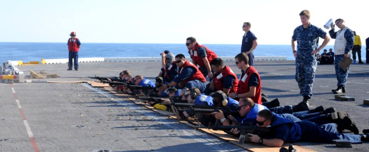 US Navy 100727-N-3852A-100 Line Coaches from the weapons department of the amphibious assault ship USS Wasp (LHD 1) observe Sailors participating in M-16 rifle qualifications