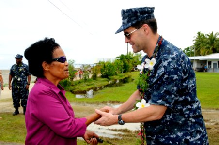US Navy 100727-N-4031K-449 Vice Adm. John Bird shakes hands with Romana Anastacio at Ngchesar Elementary School in Koror, Palau
