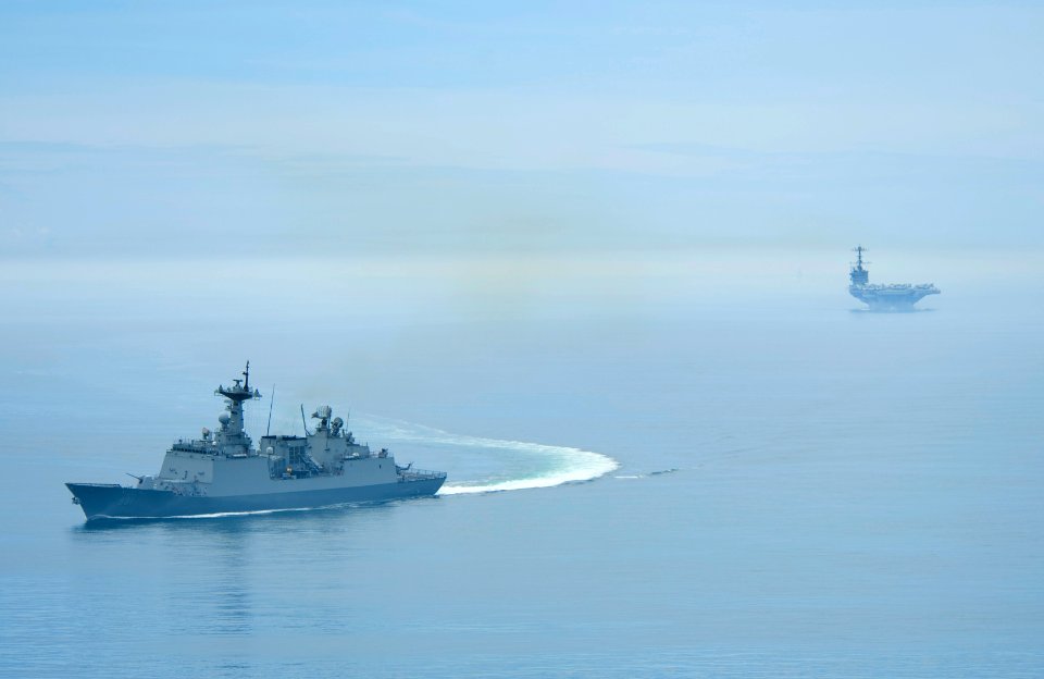 US Navy 100725-N-6720T-114 Choi Young (DDH 981) escorts USS Goerge Washington (CVN 73) after leaving the port of Busan, Republic of Korea