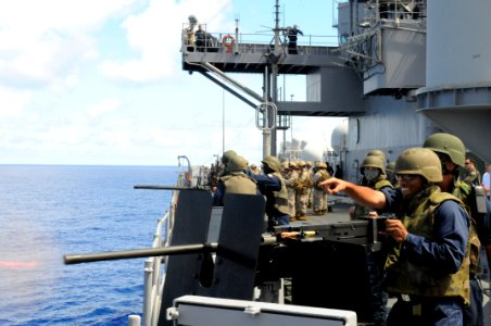 US Navy 100724-N-1675O-298 Sailors fire a 50-caliber machine during a gun shoot aboard USS Blue Ridge (LCC 19)