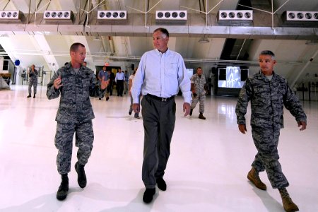 US Navy 100728-F-6655M-021 U.S. Deputy Secretary of Defense William J. Lynn III, center, tours the new RQ-4 Global Hawk Hangar area on Andersen Air Force Base, Guam