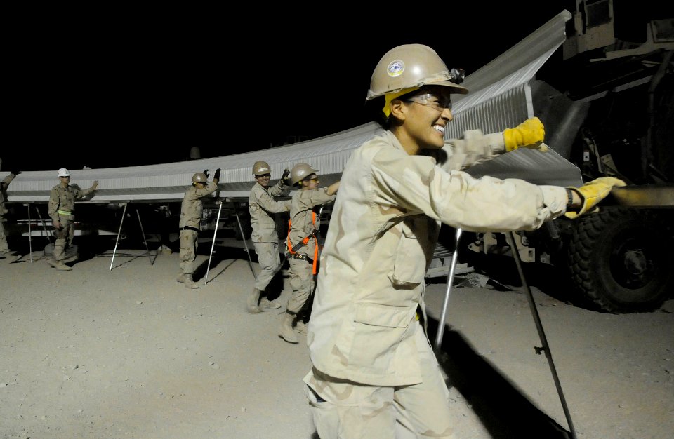 US Navy 100725-N-0475R-160 Seabees assigned to Naval Mobile Construction Battalion (NMCB) 5 erect a K-SPAN building at a project at Camp Leatherneck, Afghanistan