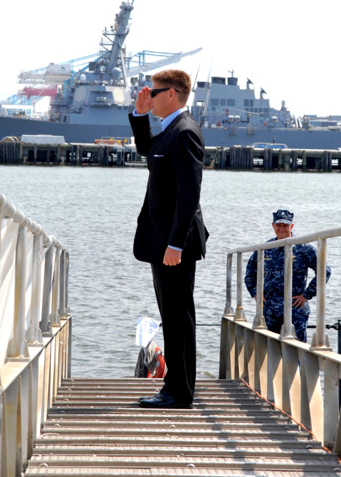 US Navy 100728-N-7705S-008 Juan M. Garcia III, Assistant Secretary of the Navy for Manpower and Reserve Affairs, salutes the national ensign as he boards the Los Angeles-class attack submarine USS Scranton (SSN 756)