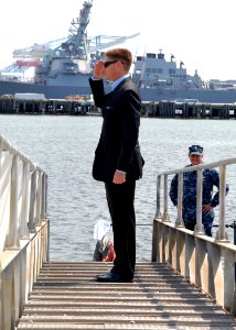 US Navy 100728-N-7705S-008 Juan M. Garcia III, Assistant Secretary of the Navy for Manpower and Reserve Affairs, salutes the national ensign as he boards the Los Angeles-class attack submarine USS Scranton (SSN 756) photo