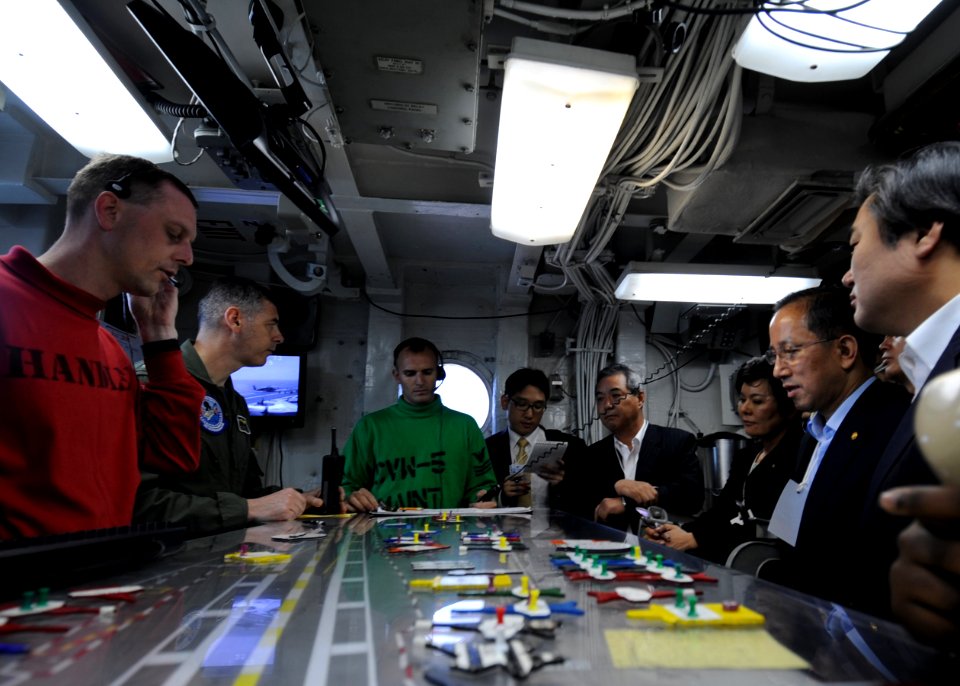 US Navy 100727-N-7191M-040 Capt. Daniel Grieco, executive officer of the aircraft carrier USS George Washington (CVN 73) speaks to Republic of Korea Minister of National Defense Tae Young Kim