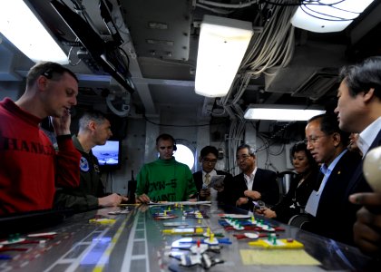 US Navy 100727-N-7191M-040 Capt. Daniel Grieco, executive officer of the aircraft carrier USS George Washington (CVN 73) speaks to Republic of Korea Minister of National Defense Tae Young Kim