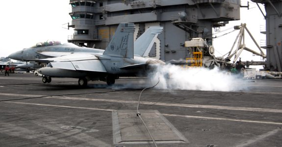 US Navy 100726-N-4135M-143 An F-A-18F Super Hornet assigned to the Swordsmen of Strike Fighter Squadron (VFA) 32 lands aboard the aircraft carrier USS Harry S. Truman (CVN 75)