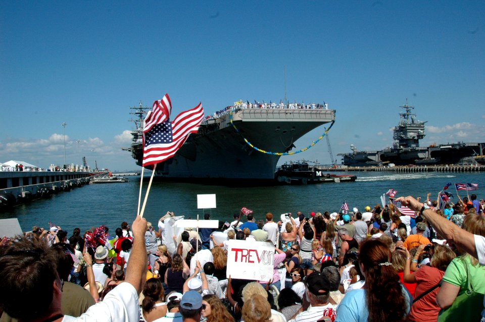 US Navy 100728-N-9806M-137 Family and friends await the arrival of the Nimitz-class aircraft carrier USS Dwight D. Eisenhower (CVN 69) at Naval Station Norfolk after a seven-month deployment