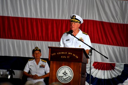 US Navy 100729-N-8273J-308 Chief of Naval Operations (CNO) Adm. Gary Roughead delivers remarks while Rear Adm. Nora Tyson looks on during the Carrier Strike Group (CSG) 2 change of command ceremony photo