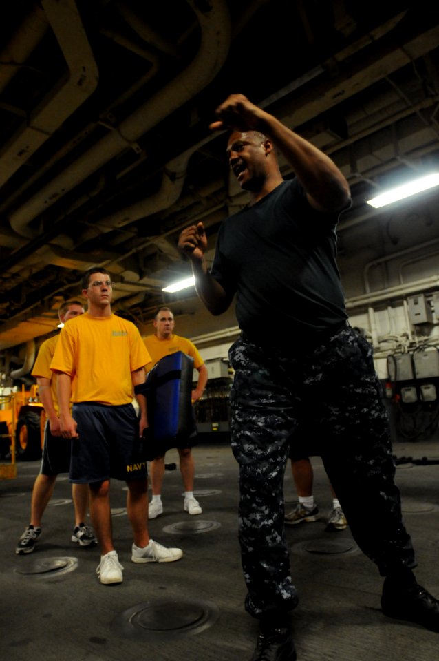 US Navy 100727-N-3852A-733 Master-At-Arms 1st Class Reginald Allen, security training supervisor aboard the amphibious assault ship USS Wasp (LHD 1) teaches various self-defense techniques
