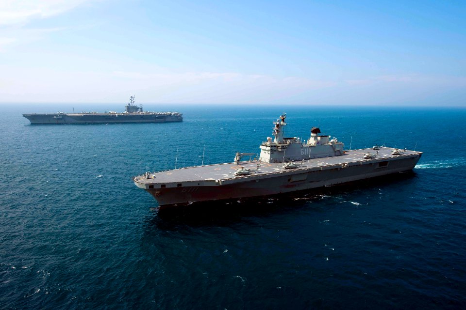 US Navy 100727-N-6720T-079 The Republic of Korea Navy amphibious landing ship ROKS Dokdo (LPH 6111) and the aircraft carrier USS George Washington (CVN 73) transit the Sea of Japan