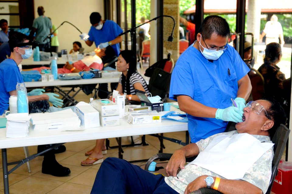 US Navy 100727-N-7478G-509 Hospital Corpsman 2nd Class Florencio Stamberger cleans a Palauan resident's teeth at a free dental clinic supporting Pacific Partnership 2010 in Koror, Palau