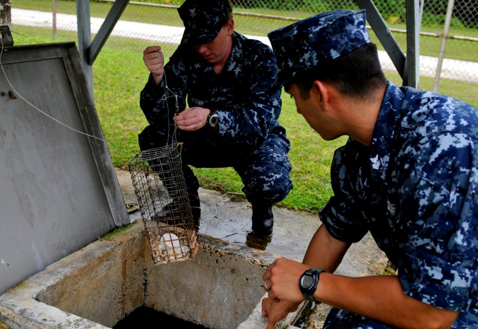 US Navy 100727-N-7280V-403 Hospital Corpsman 2nd Class Jenna Nowaczyk, left, and Hospital Corpsman 1st Class Lee Cortez check chlorine tablets at a local well