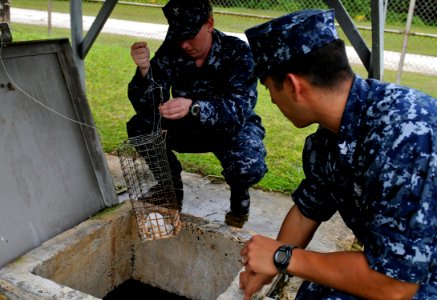US Navy 100727-N-7280V-403 Hospital Corpsman 2nd Class Jenna Nowaczyk, left, and Hospital Corpsman 1st Class Lee Cortez check chlorine tablets at a local well photo