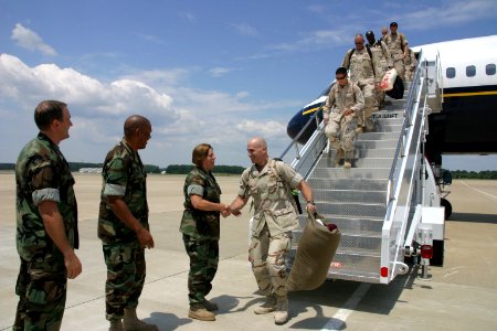 US Navy 100731-N-2888Q-042 Senior officers greet sailors assigned to KILO Detachment of Navy Cargo Handling Battalion (NCHB) 4, returning from an eight-month deployment