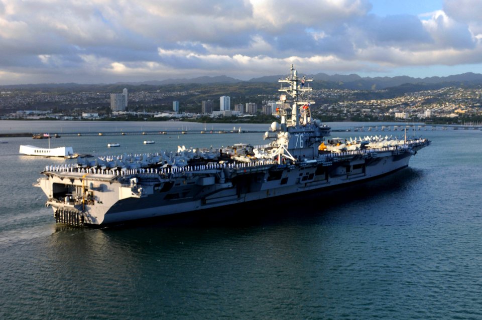 US Navy 100731-N-7605J-797 Sailors and Marines man the rails aboard the aircraft carrier USS Ronald Reagan (CVN 76) as the ship arrives in Pearl Harbor for a scheduled port visit