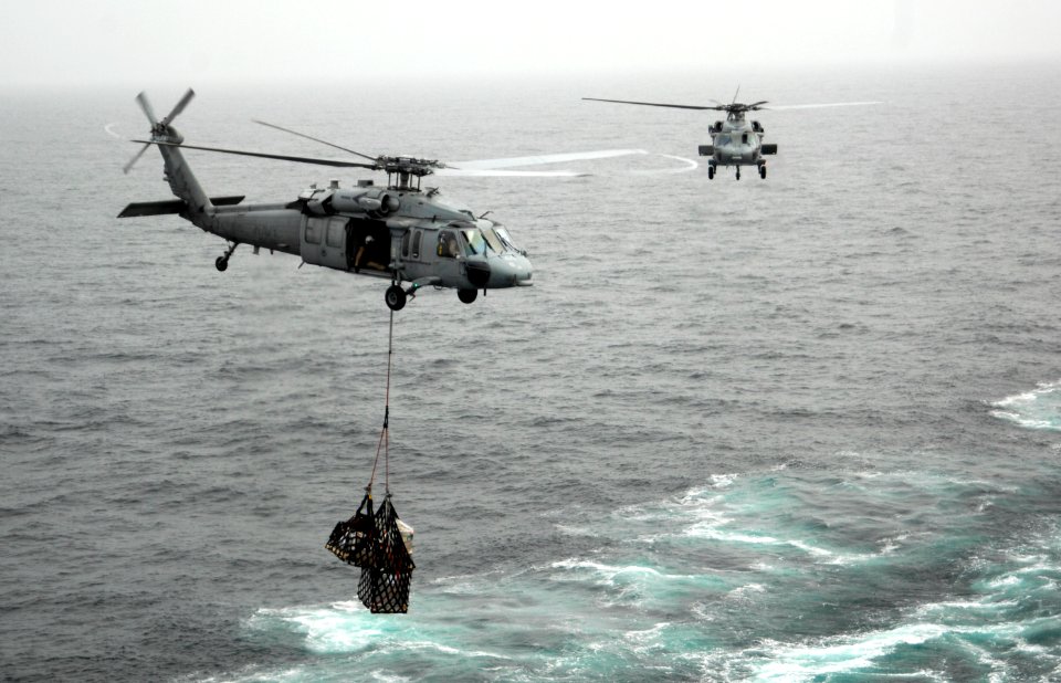 US Navy 100729-N-4135M-066 MH-60S Sea Hawk helicopters transfer supplies from USNS Sacagawea (T-AKE 2)